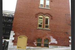 Photo-of-the-Halifax-Visiting-Dispensary-shown-a-side-view-of-the-building-and-the-yellow-door-to-the-Morgue